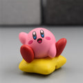 Small Kawaii Kirby sitting on star figure