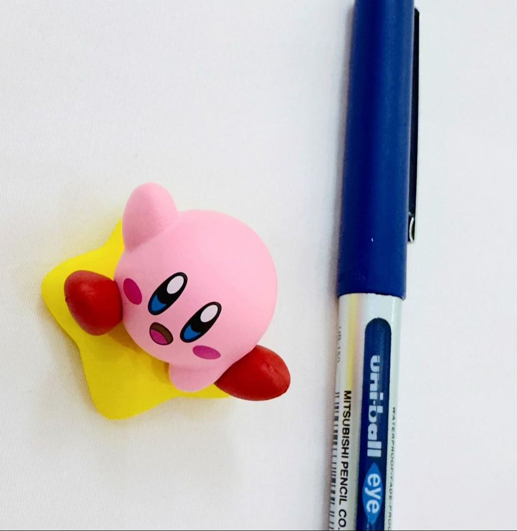 Small Kawaii Kirby sitting on star figure