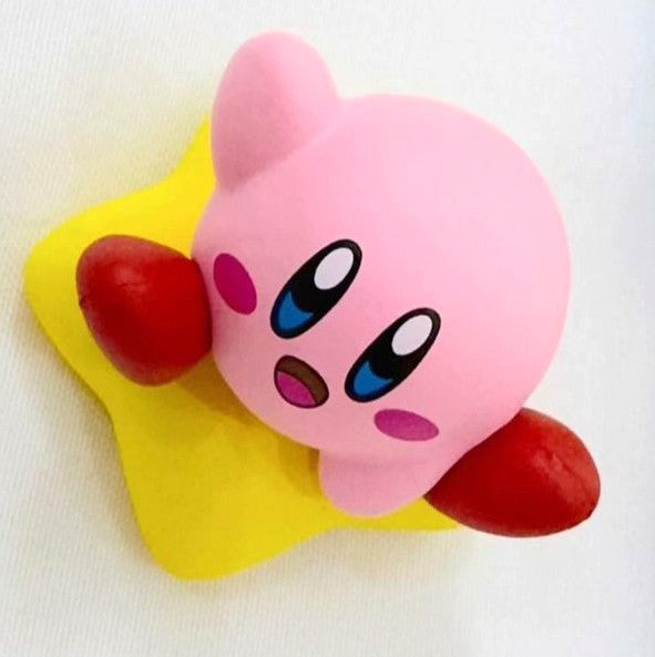 Small Kawaii Kirby sitting on star figure